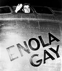 Colonel Paul Tibbets waves from the Enola Gay